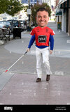 blind-man-with-cane-crosses-a-busy-intersection-A4P751.jpg